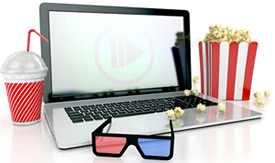 Laptop with popcorn and soda