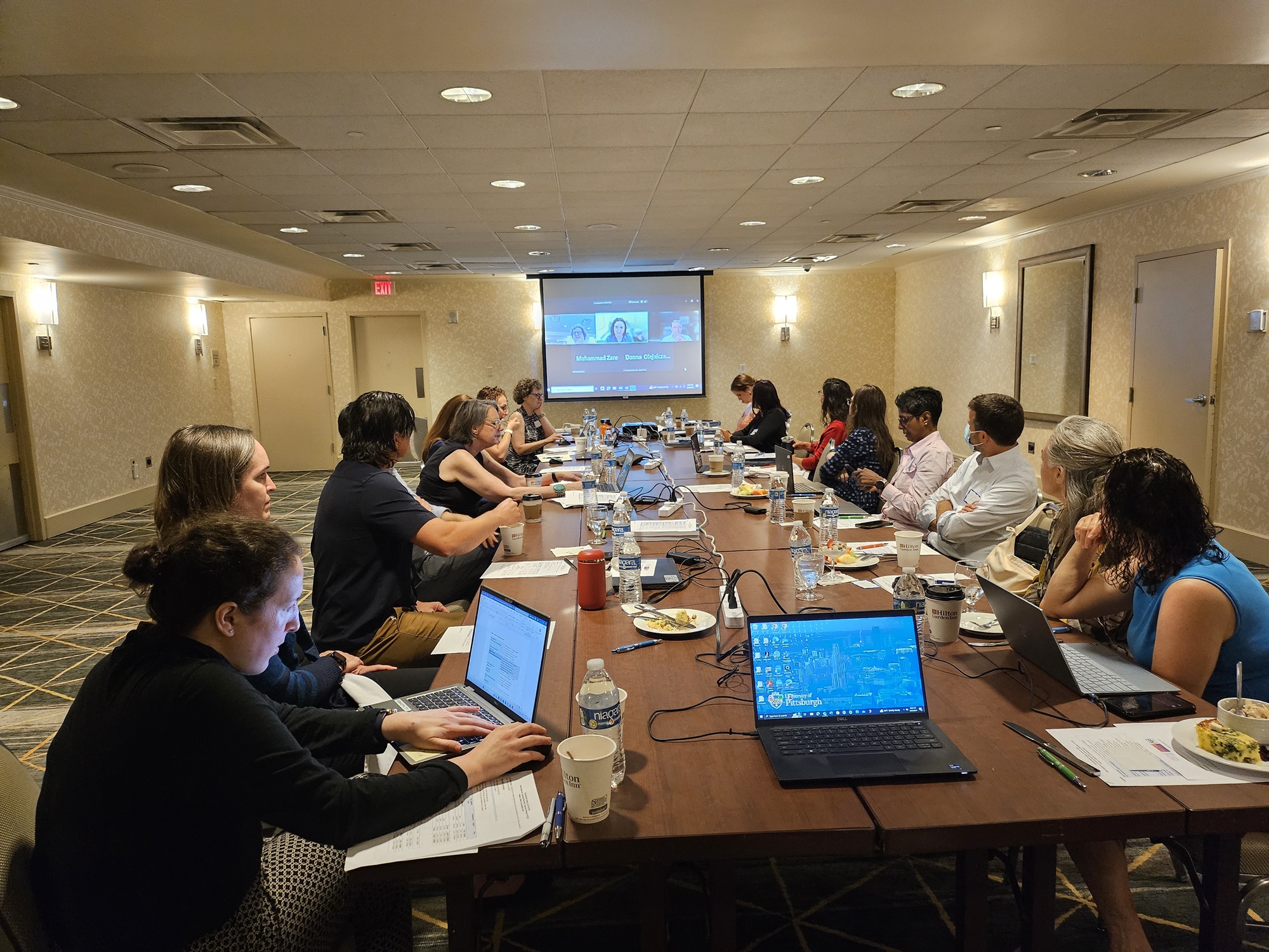 Group of people around a conference table