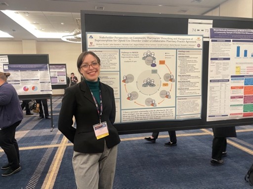 Melissa Tysko in front of her poster at AMERSA