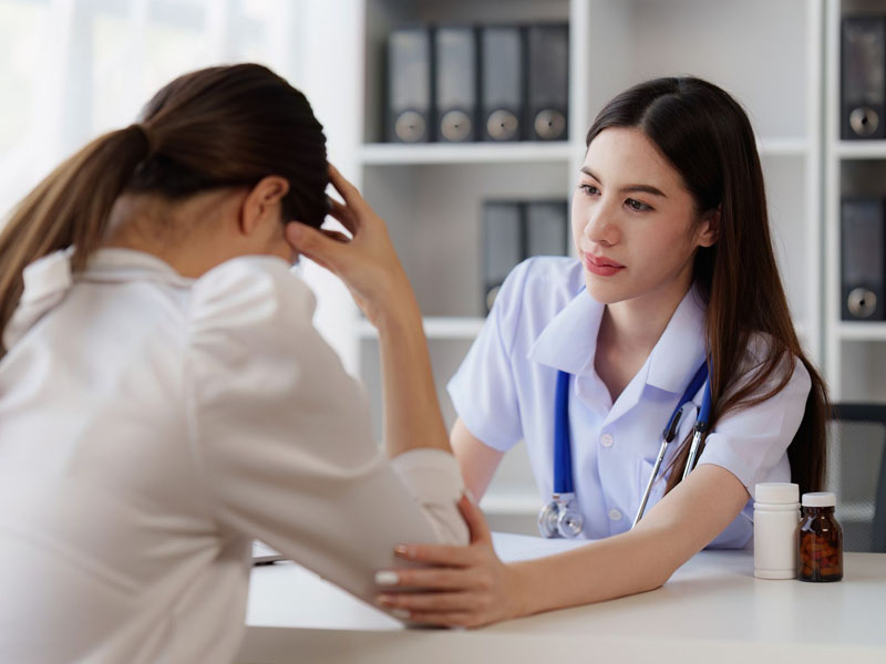 A provider comforting a patient